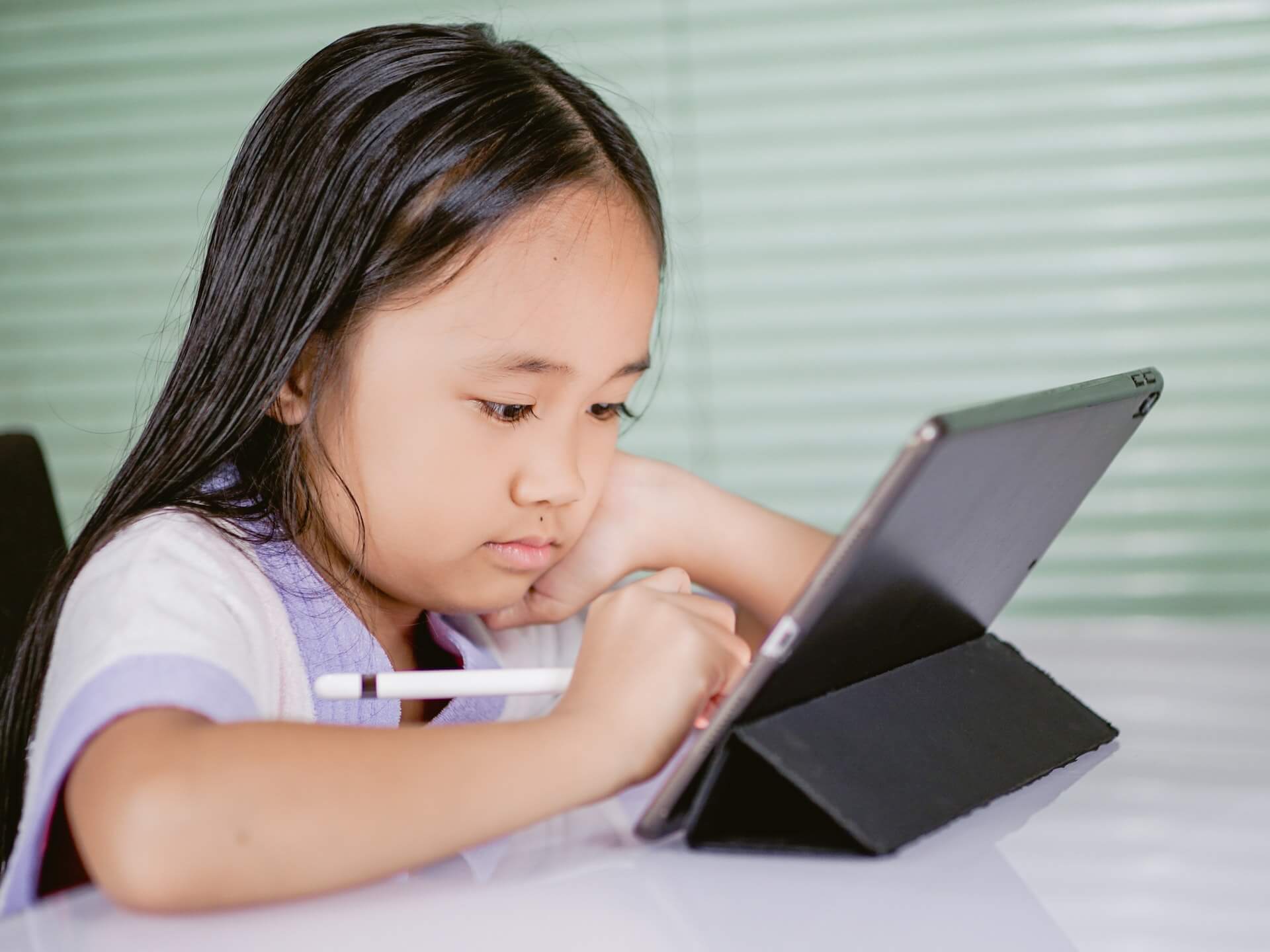 A Girl Using a Tablet Computer